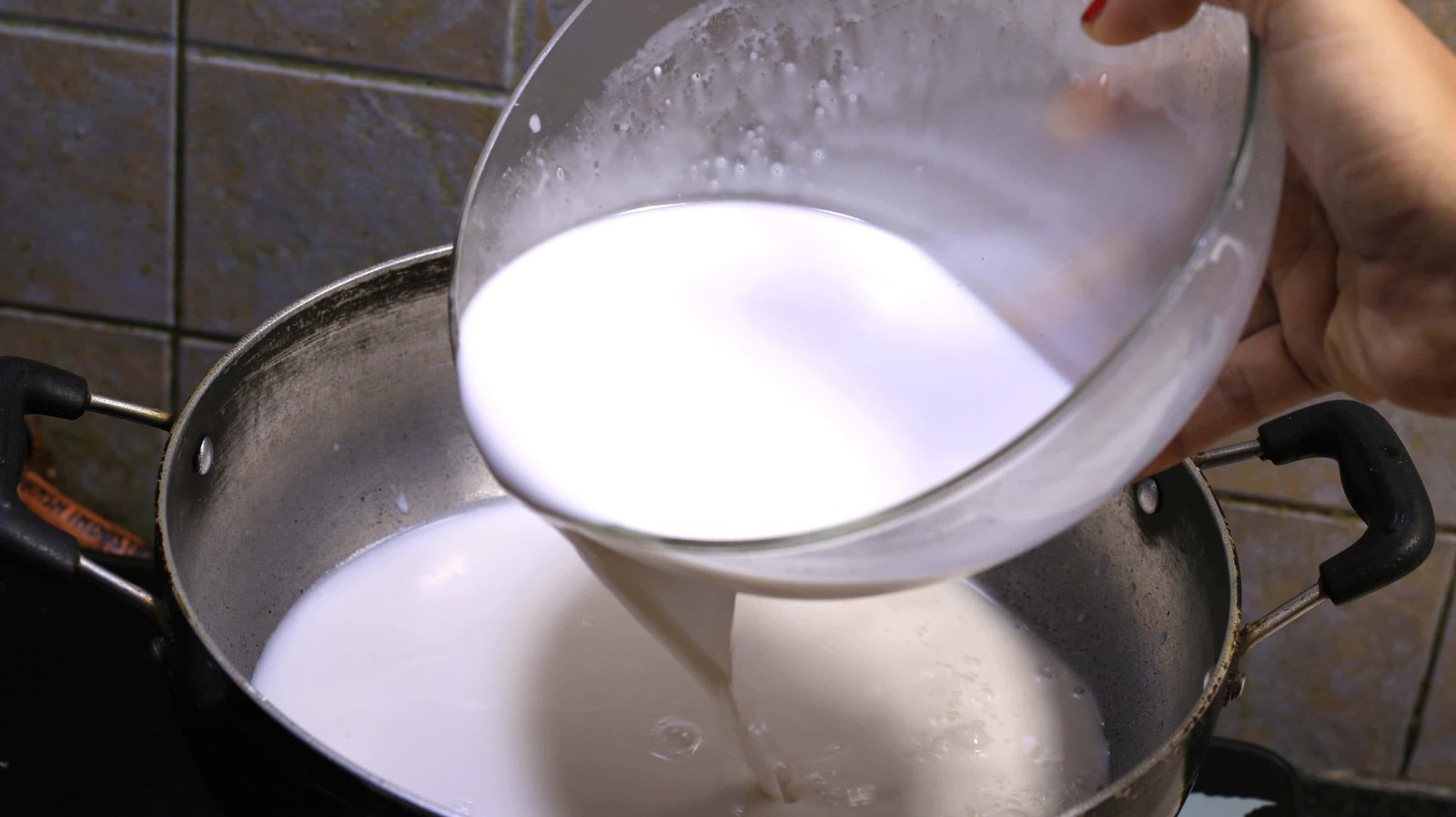 Pour coconut milk in a heavy-bottomed pan