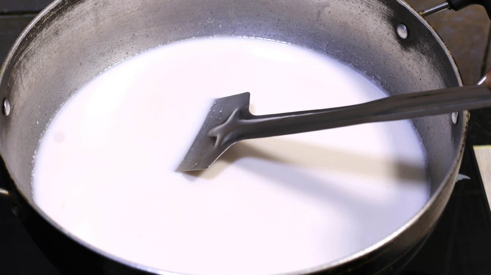 Stir the milk frequently on a low flame