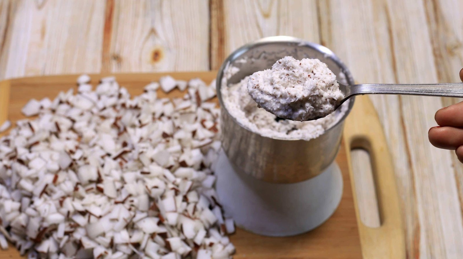 Grind coconut pieces in an extremely fine paste