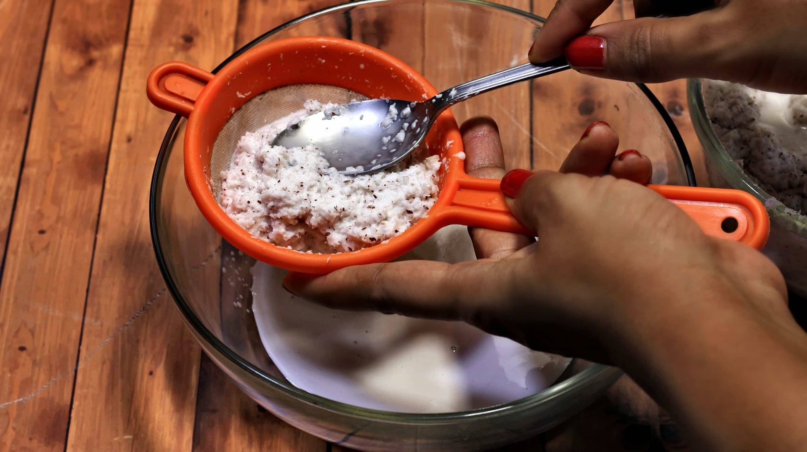 sieve coconut milk out of coconut paste